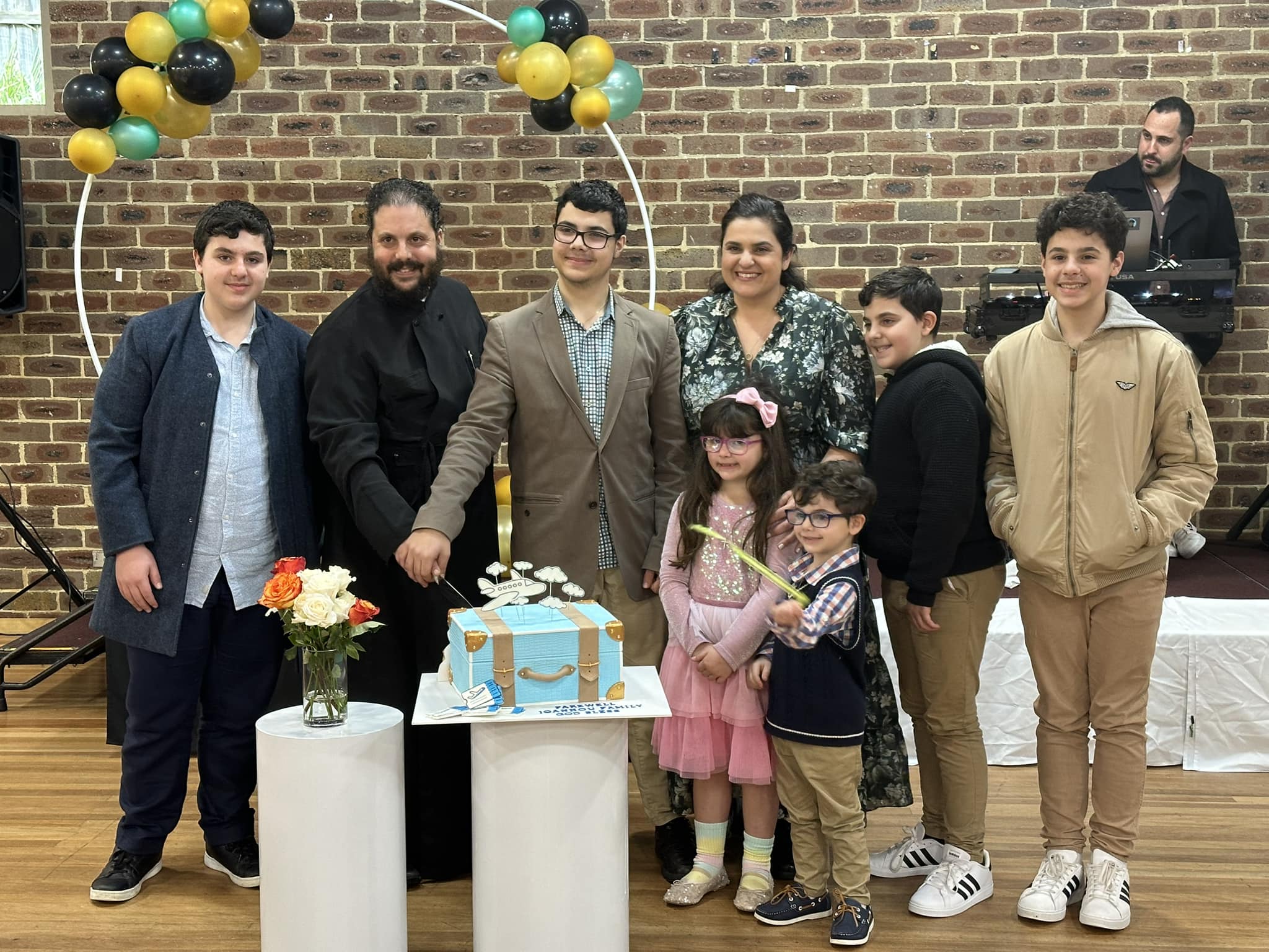 Photo of Father Andrew Joannou, Parish Priest of St Therapon Church, and his family 